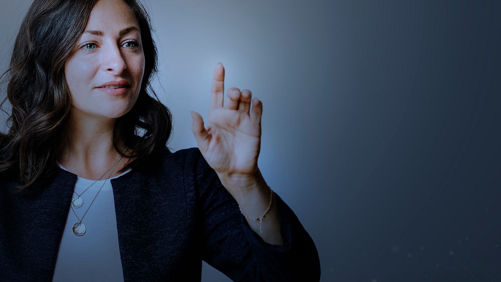 Senior businesswoman pointing on invisible screen