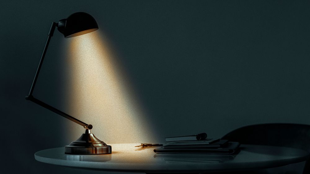 Desk lamp illuminating in the dark