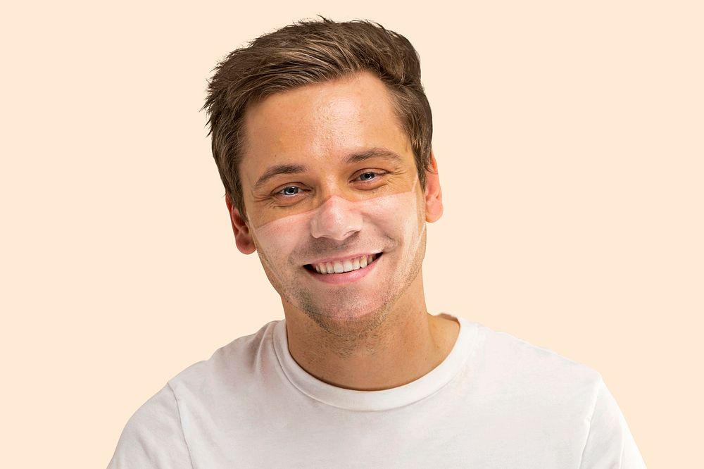 Man face mockup psd with mask tan line on cream background