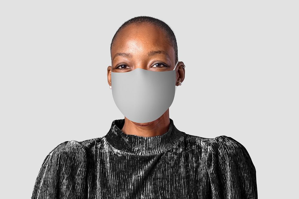 Woman wearing mask face closeup Covid-19 photoshoot on gray background