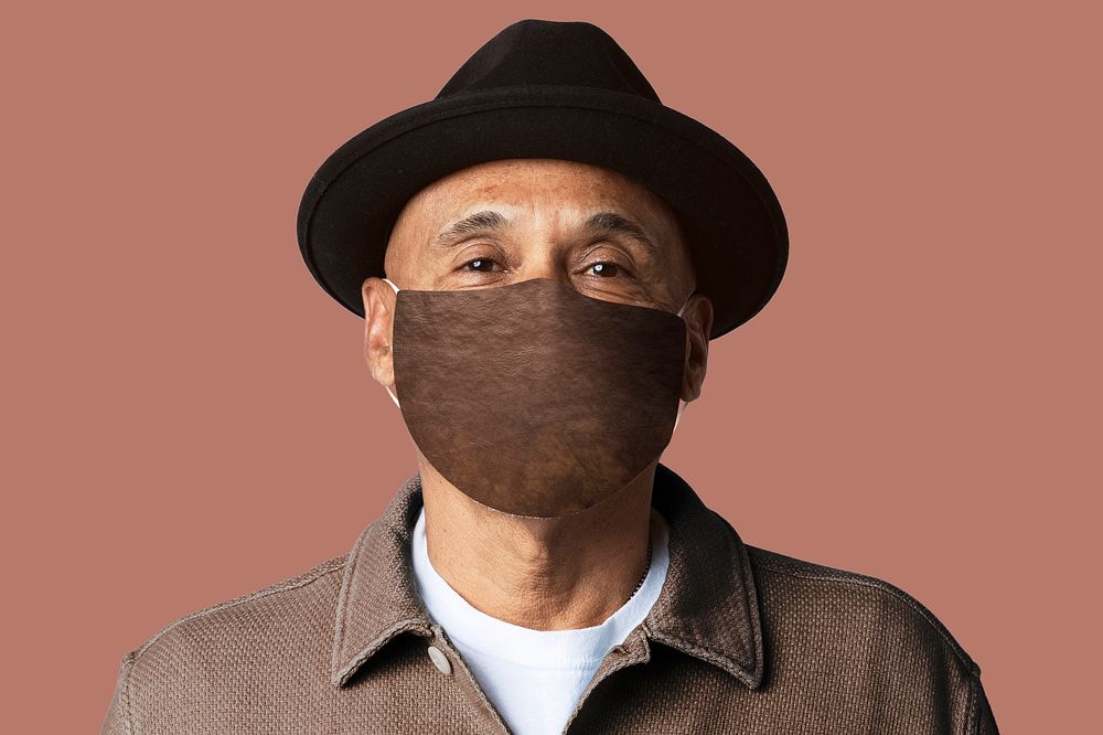 Mature man wearing mask  for Covid-19 campaign studio shoot