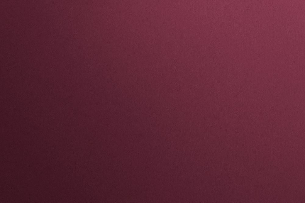 Smooth maroon concrete wall background