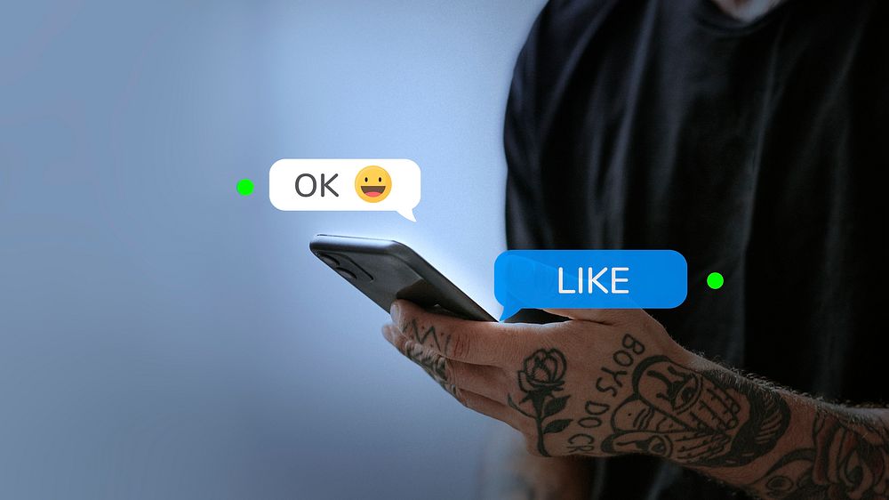 Tattooed man texting friend for social media remix