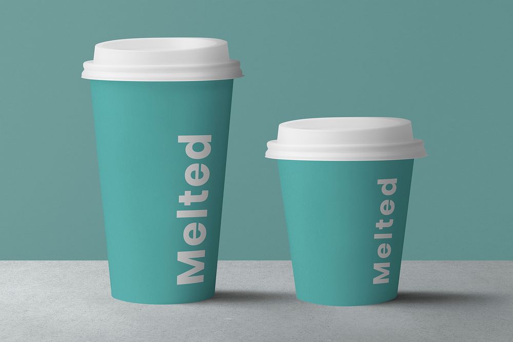 Coffee cups on green backdrops