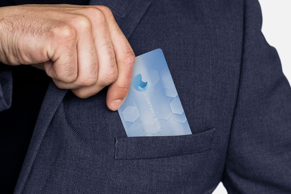 Business card in businessman's suit pocket photo