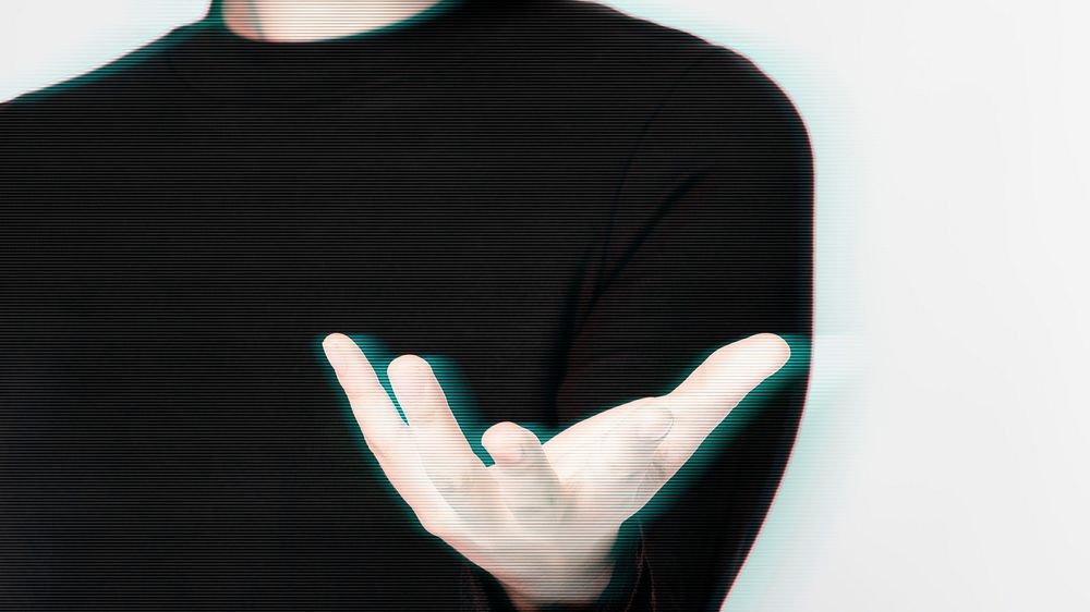 Glitching woman&rsquo;s hand background showing invisible object gesture digital remix