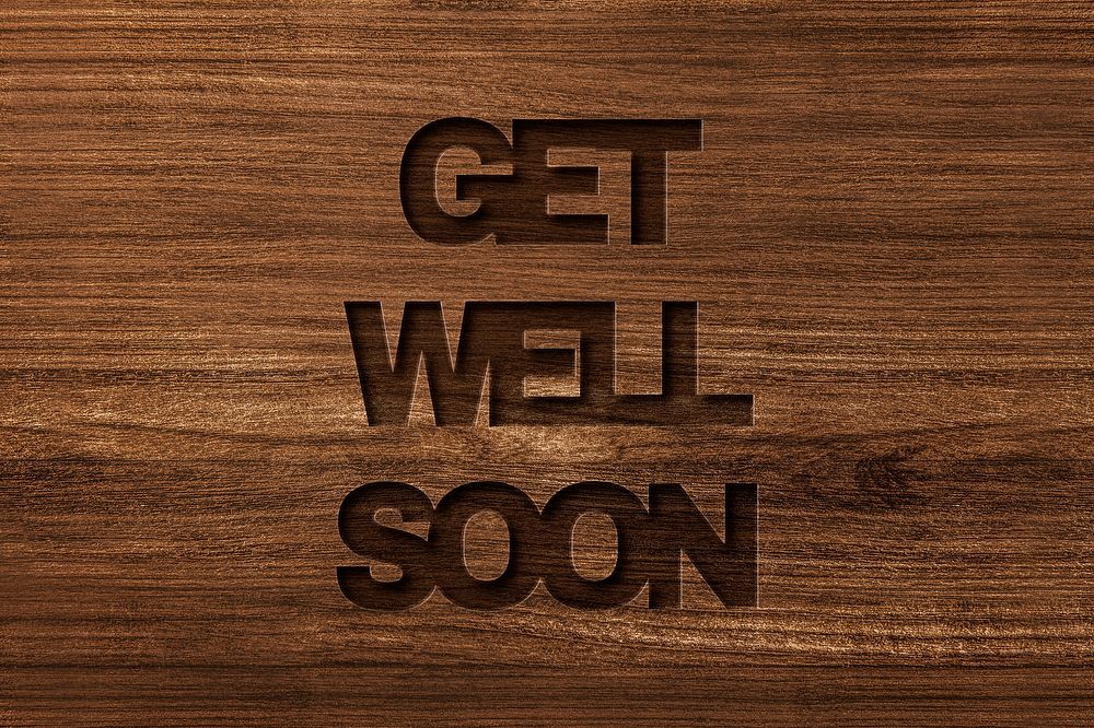 Get well soon engraved wood typography on wooden background