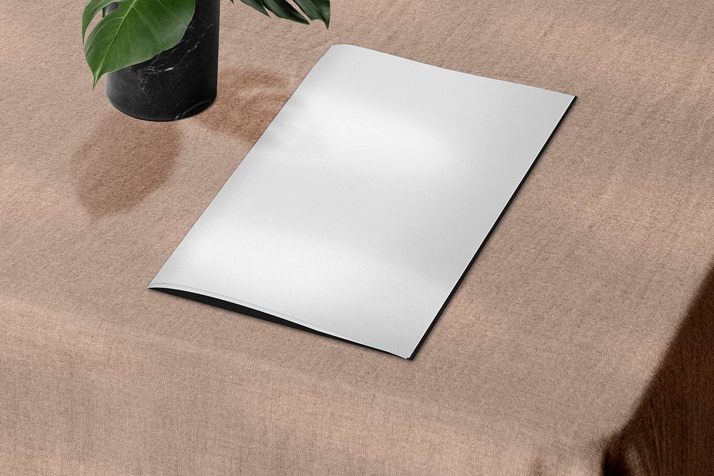 Minimal restaurant menu on a table with design space