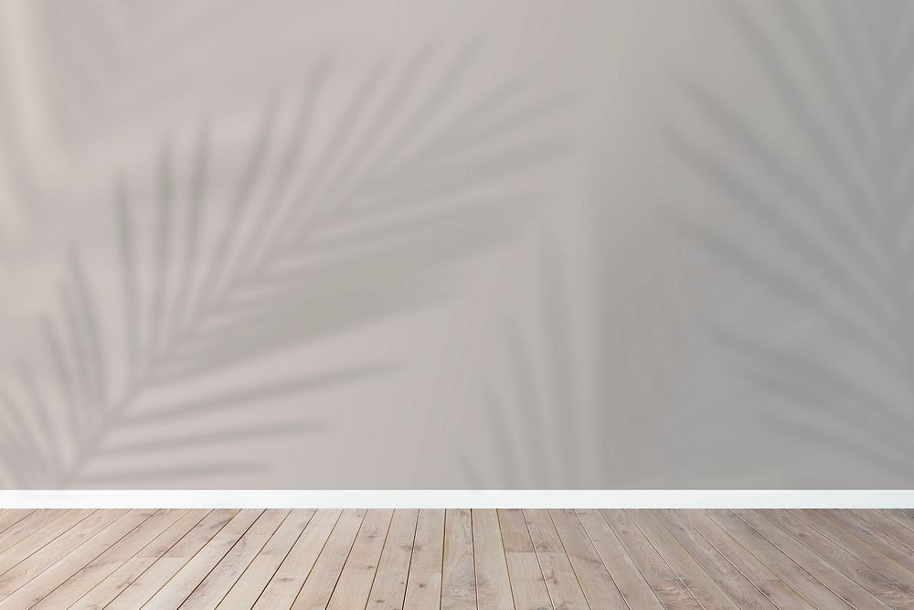 Product backdrop, empty wooden floor with tropical leaves shadow