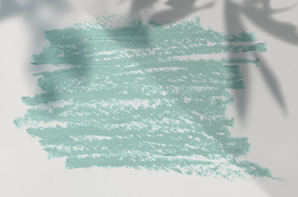 Pastel green oil paint brush stroke texture on a plain gray background