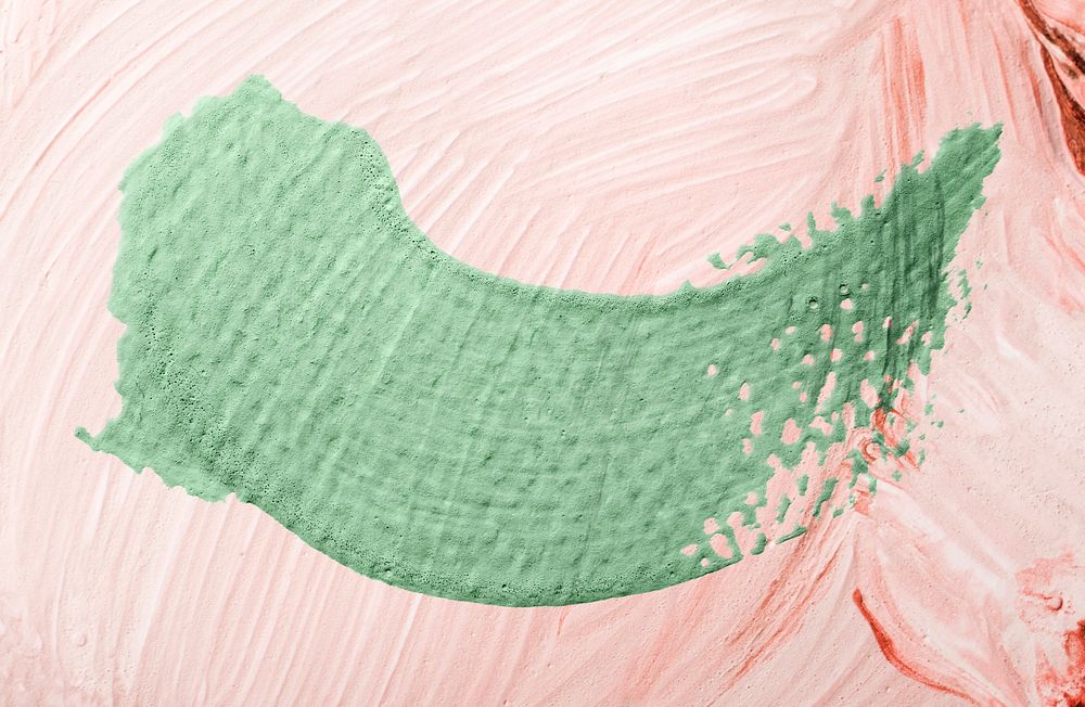 Green oil paint brush stroke texture on a pink background