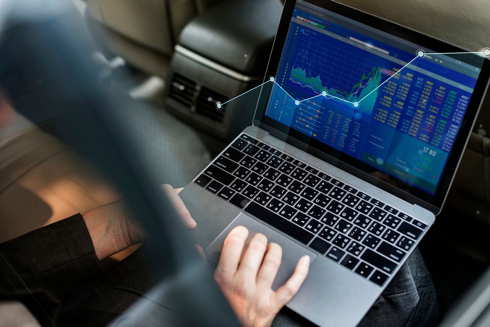 Businessman checking the stock market from a laptop