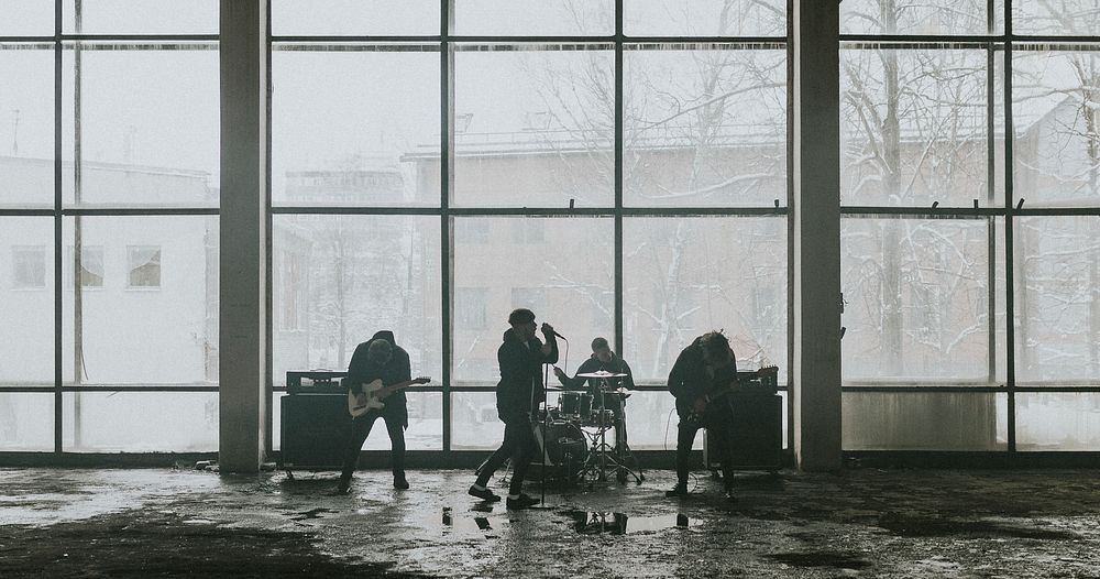 Music band rehearsing in an industrial building