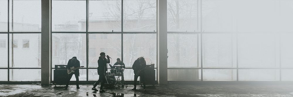 Music band rehearsing in an industrial building