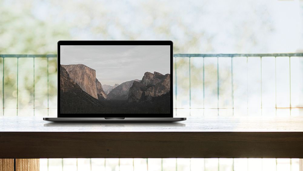 Nature screen laptop on wooden table photo