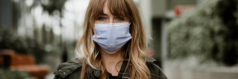 Woman wearing a face mask in public during coronavirus pandemic