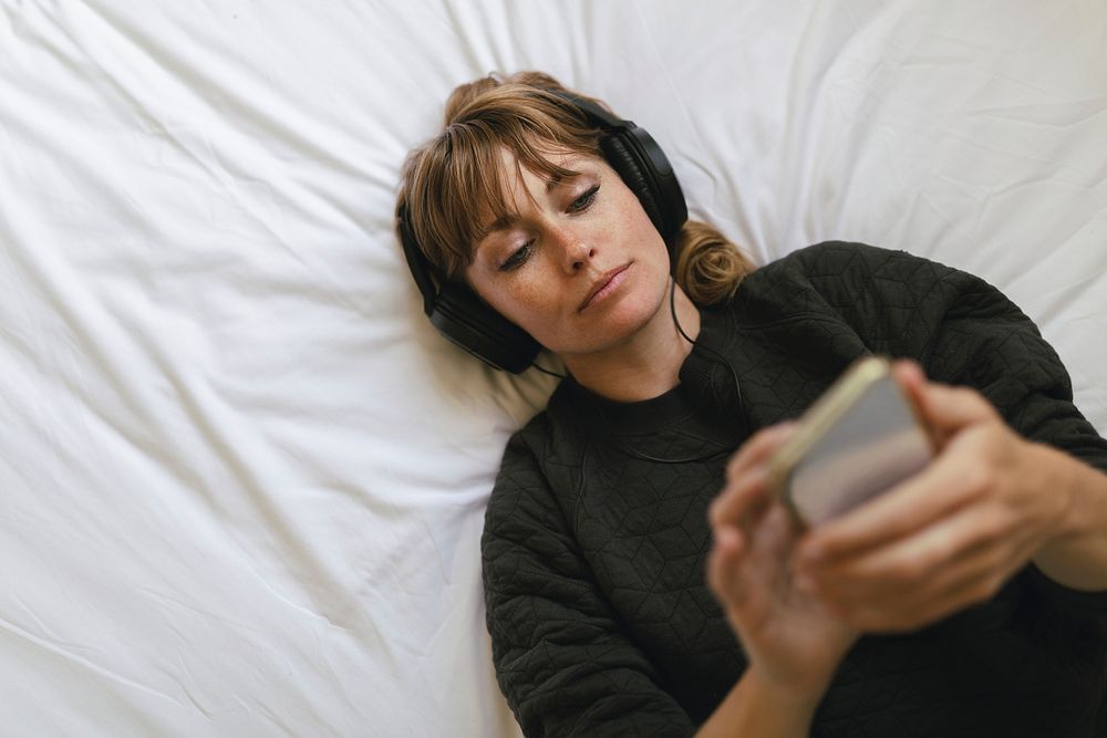 Woman listening to music  during coronavirus quarantine