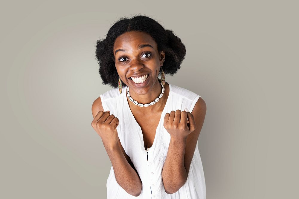 Happy black woman doing a successful hand gesture