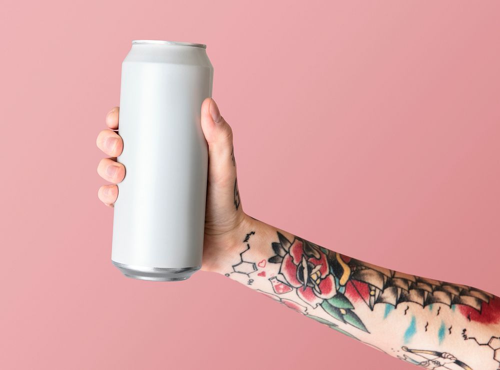 Hand holding a white aluminum can psd