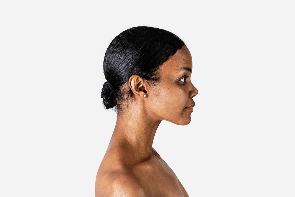 Bare chested black woman in a profile shot