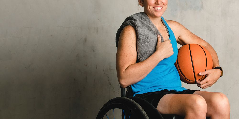 Female athlete in a wheelchair with a basketball