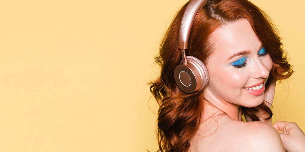 Woman listening to music through her headphones