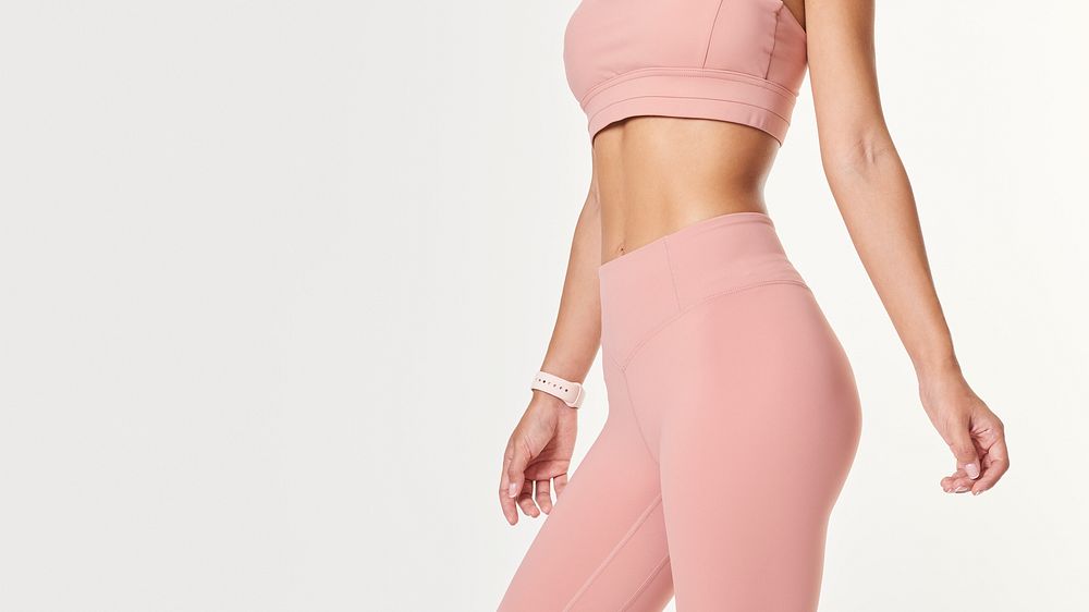 Woman wearing baby pink workout leggings  