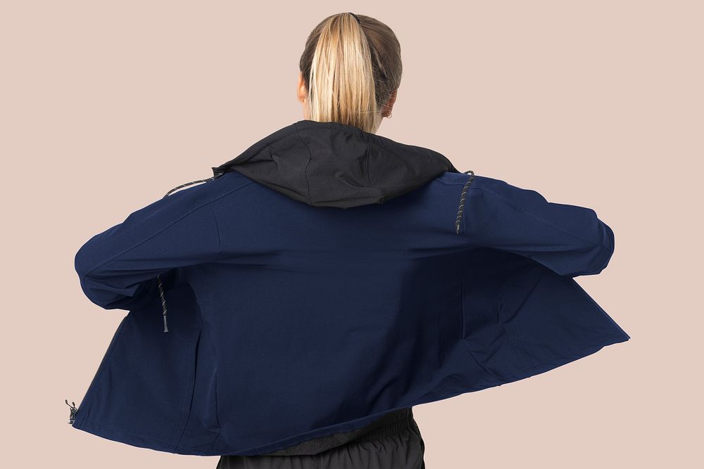 Blonde woman in windbreaker jacket for sportswear fashion photoshoot rear view