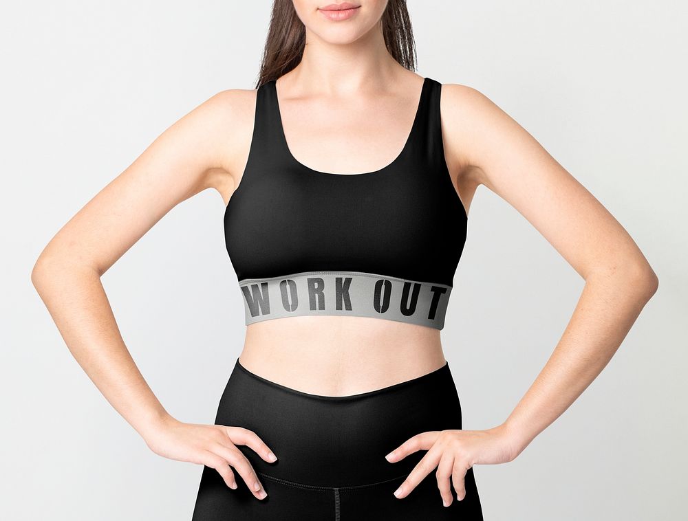 Woman in black sports bra and leggings activewear apparel full body