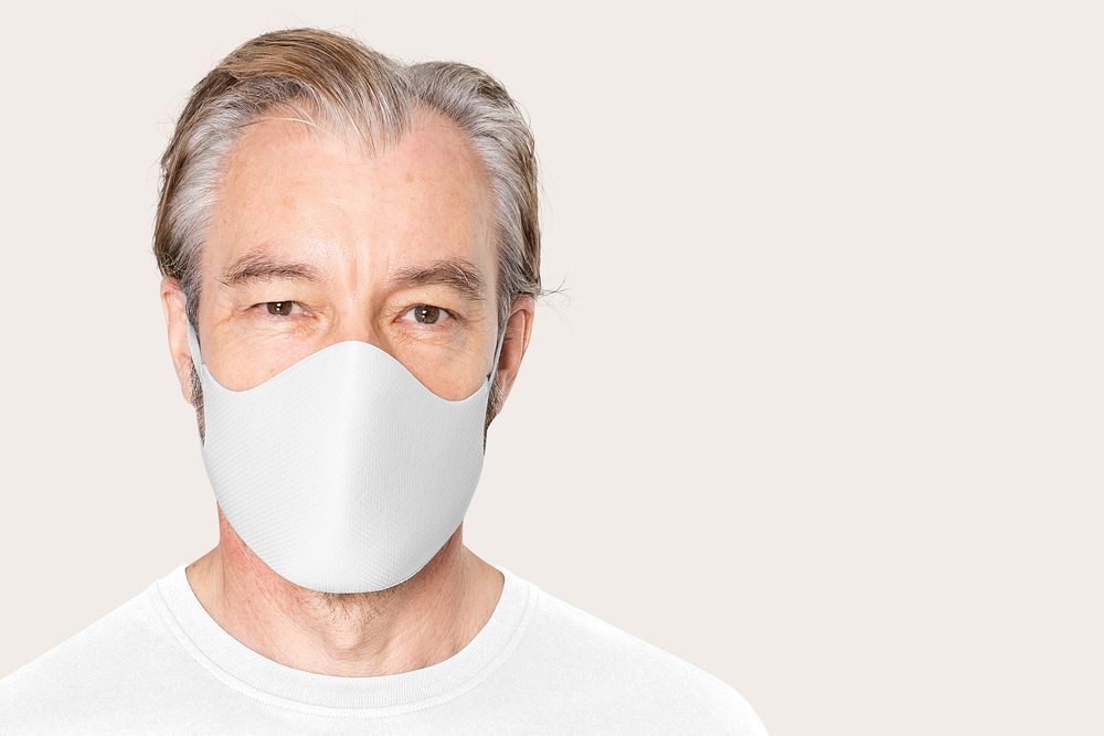 Senior man wearing white face mask covid-19 campaign with design space