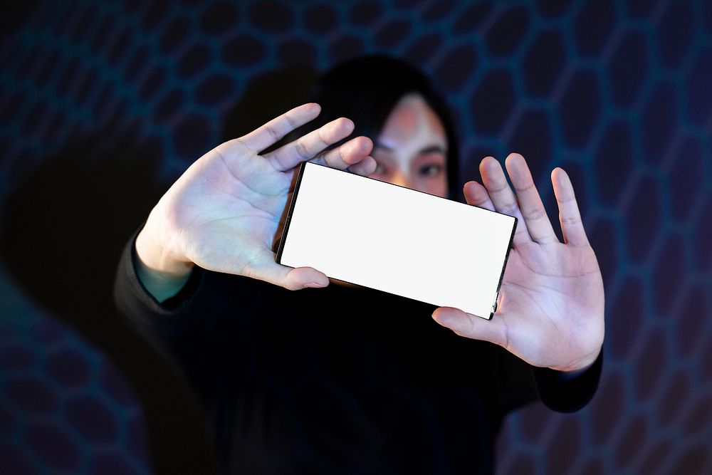 A woman showing her smartphone with both hands