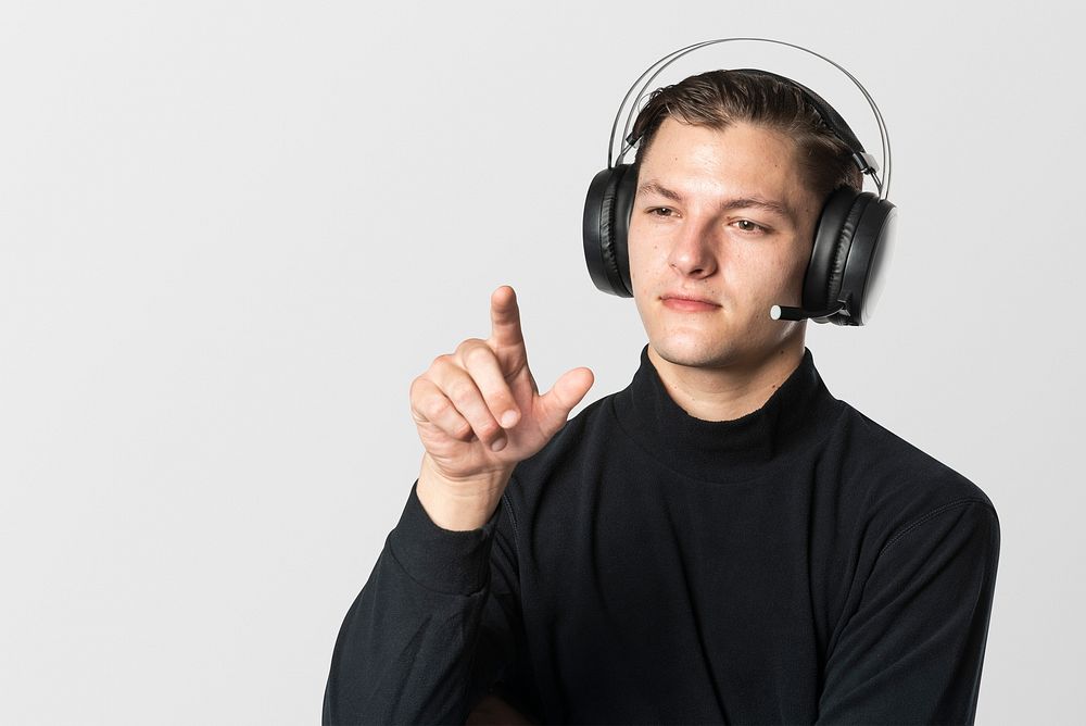 Man with headphones pointing out his finger