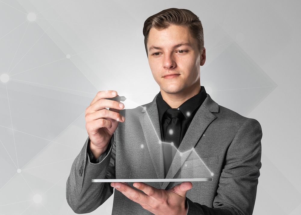 Businessman using futuristic tablet smart technology