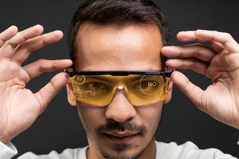 Man wearing smart glasses with self-driving hologram