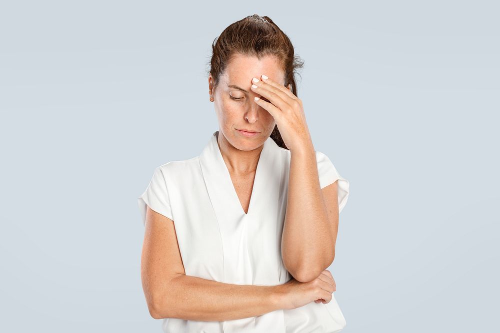 Stressed woman touching her forehead