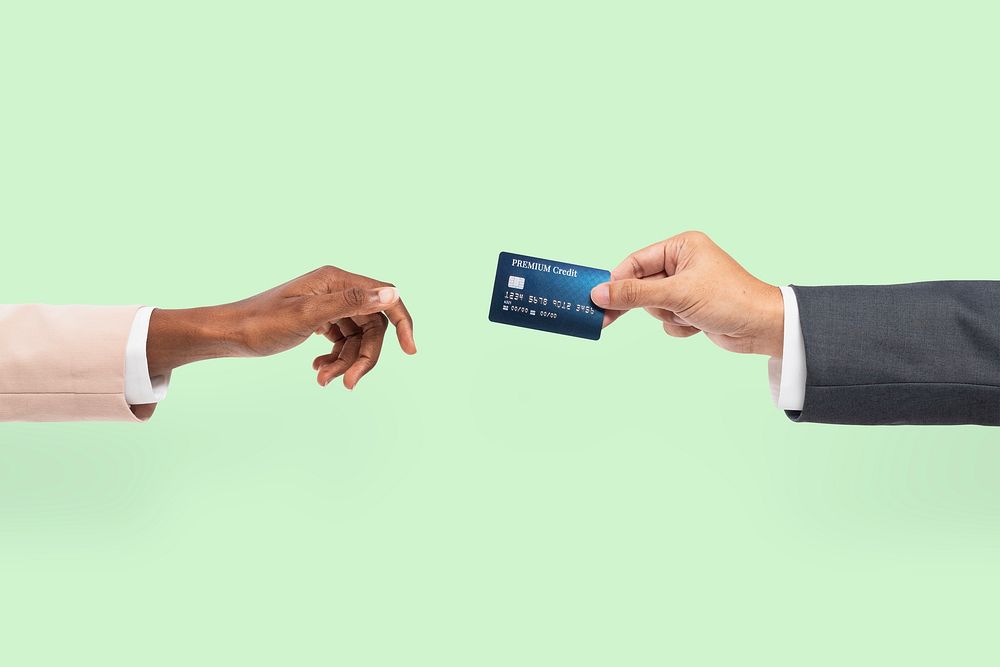 Credit card finance held by a hand for banking campaign