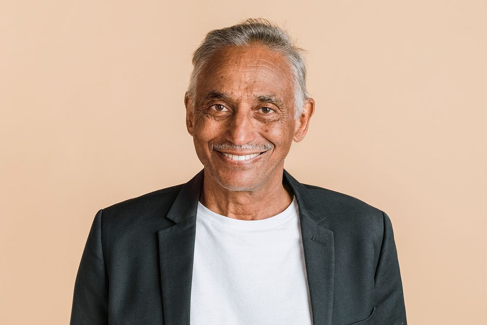 Happy mixed Indian senior man in a blazer