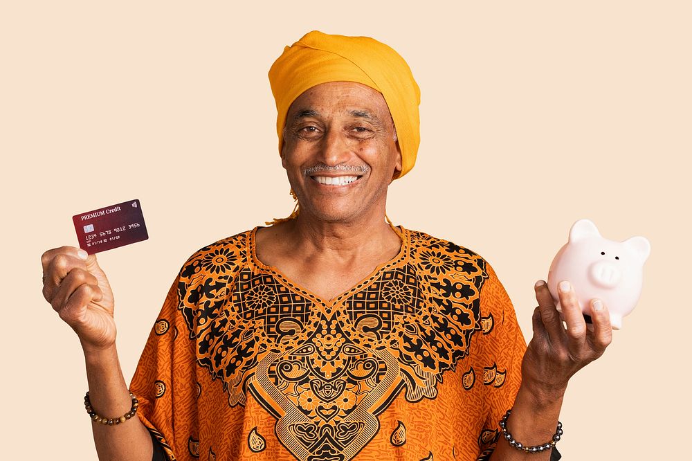 Happy mixed Indian man with a credit card and a piggy bank mockup 