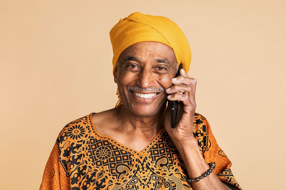 Senior mixed Indian man talking on the phone