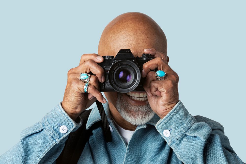 Senior man with a digital camera mockup 