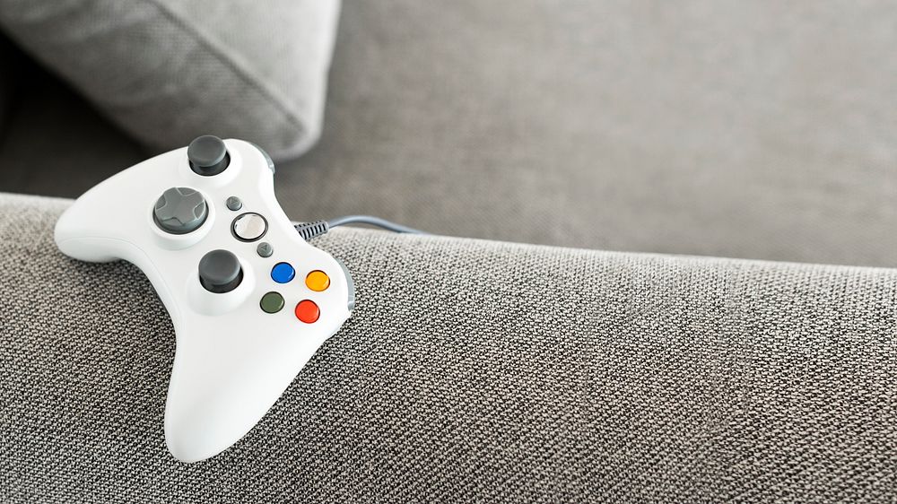 Game console on the couch banner