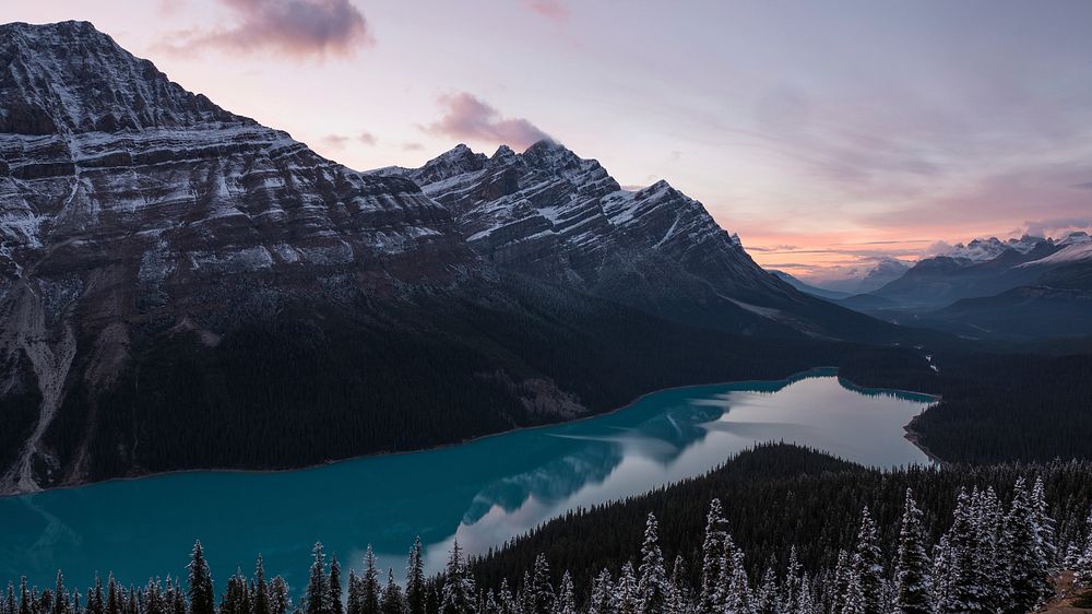 Snow-topped mountains along the shore of Peyto Lake during sunset. Original public domain image from Wikimedia Commons