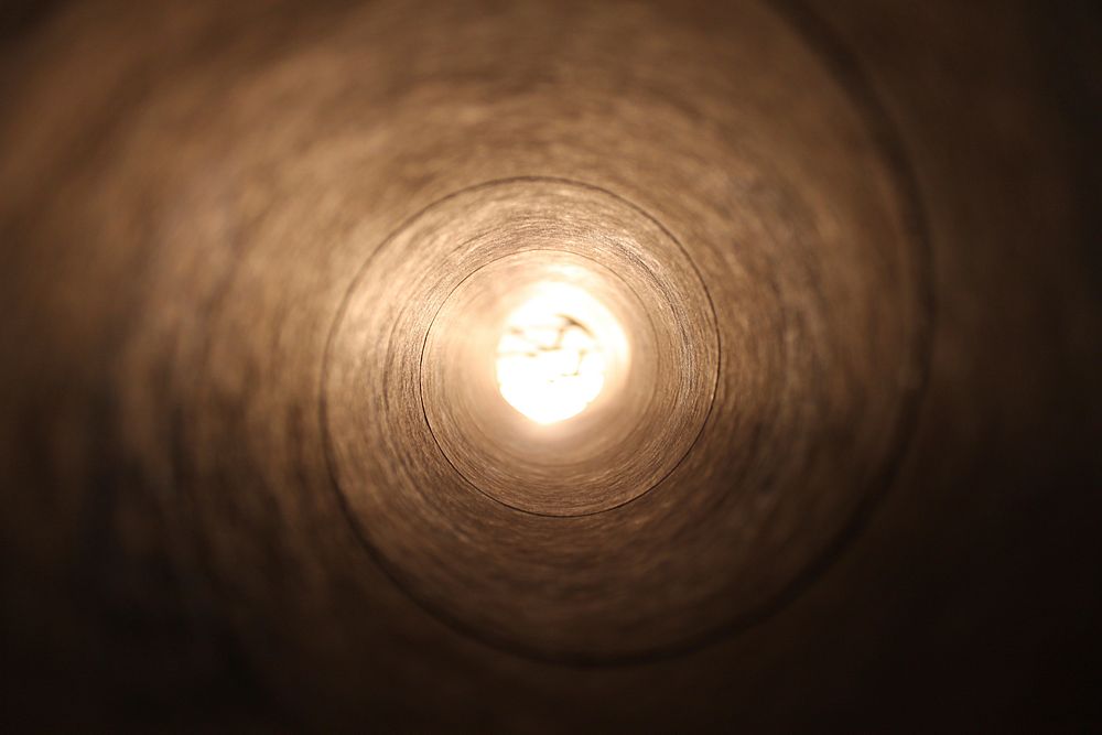 Light at the end of tunnel. Original public domain image from Wikimedia Commons