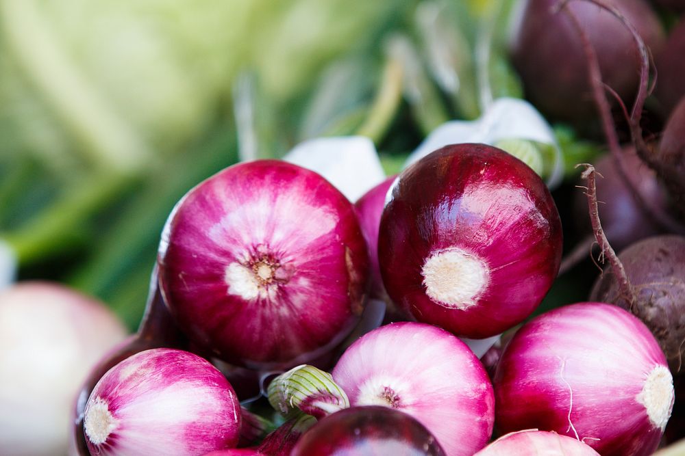 Red onions and beets stacked in a basket at the farmer's market. Original public domain image from Wikimedia Commons