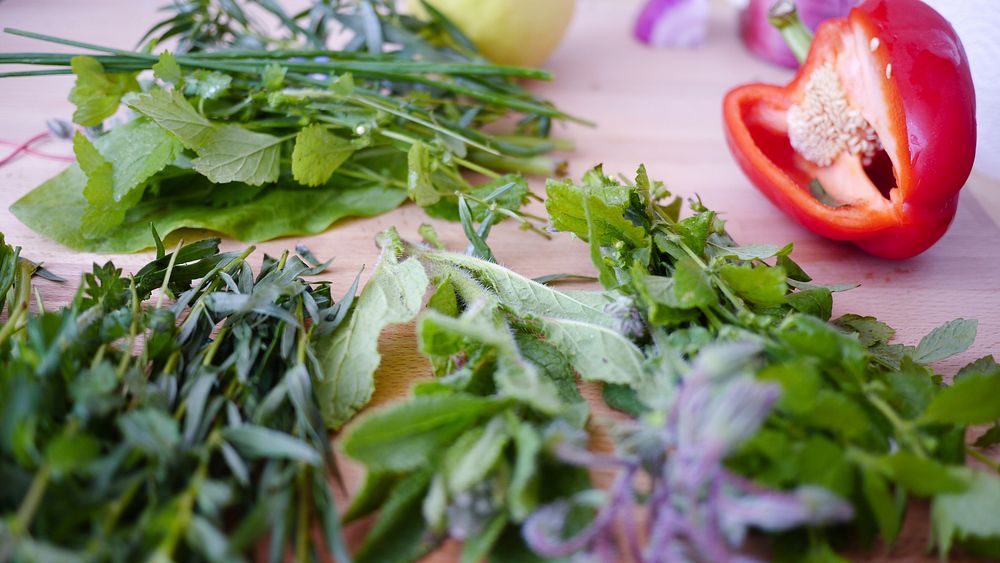 Freshly chopped herbs and vegetables on a cutting board. Original public domain image from Wikimedia Commons