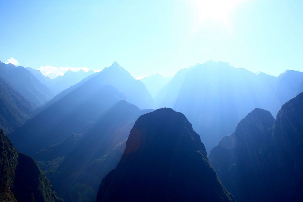 Sunlight fills green mountain valleys near Machu Picchu. Original public domain image from Wikimedia Commons