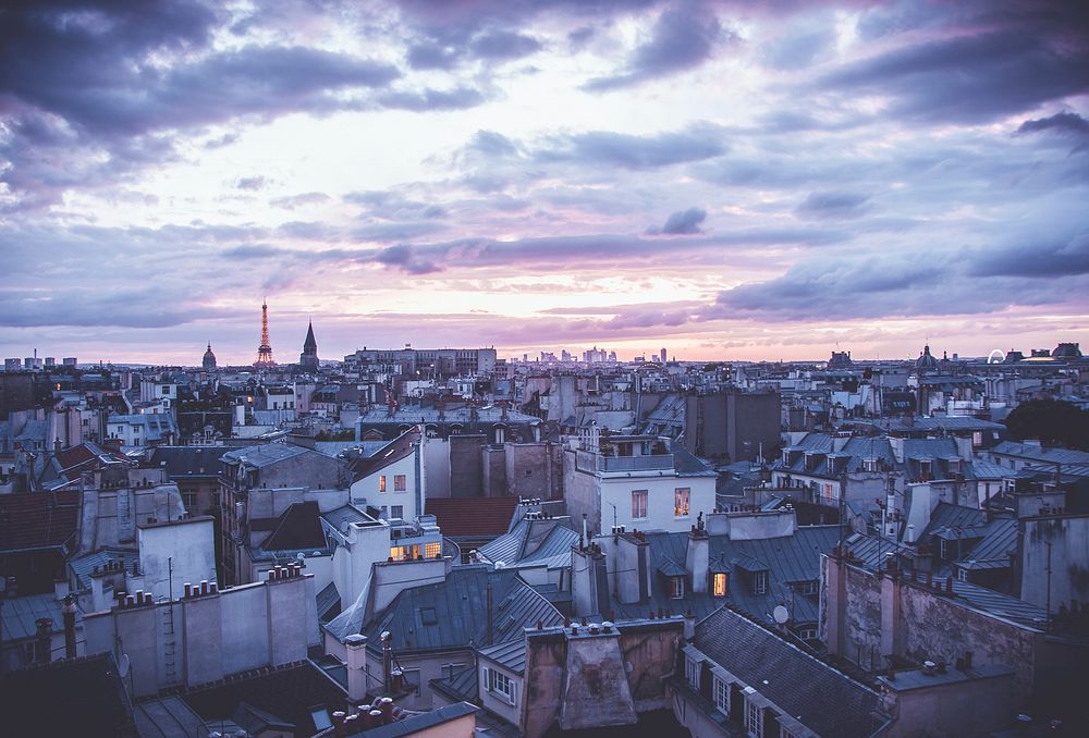 A view of the urban cityscape and clouds from a rooftop of Paris.. Original public domain image from Wikimedia Commons