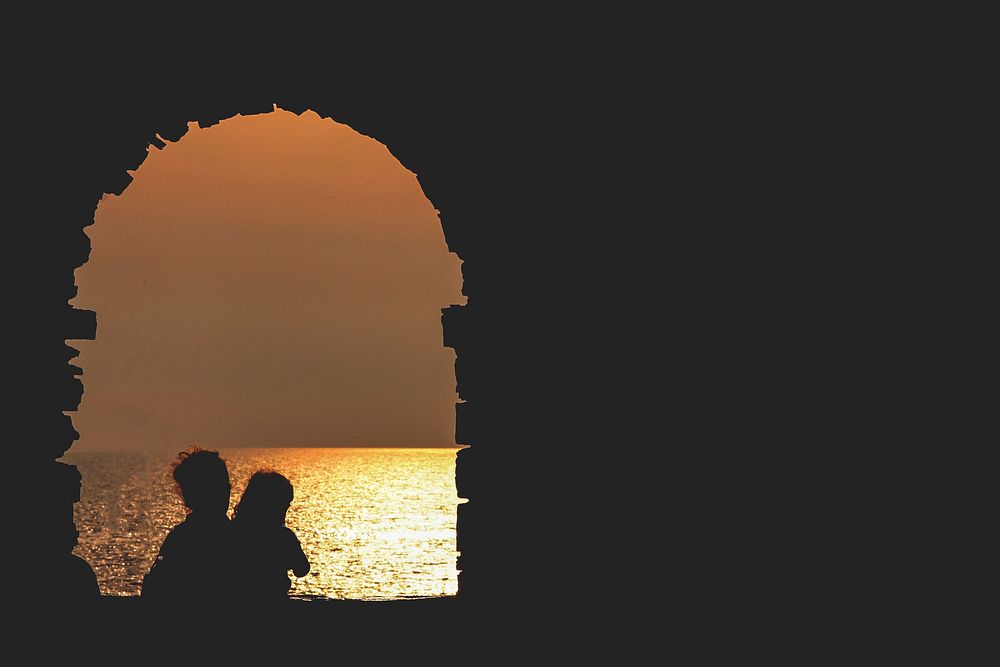 Two person silhouette in the sunset, Manarola, Italy. Original public domain image from Wikimedia Commons