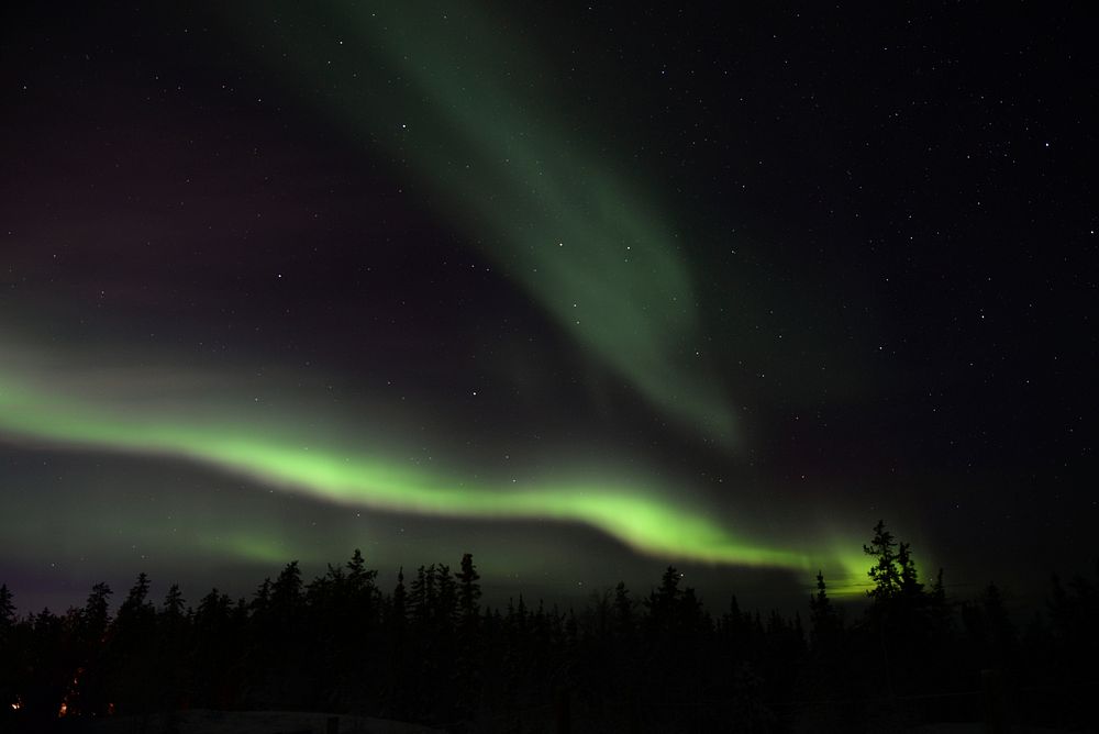 Green polar lights in the sky over Yellowknife. Original public domain image from Wikimedia Commons