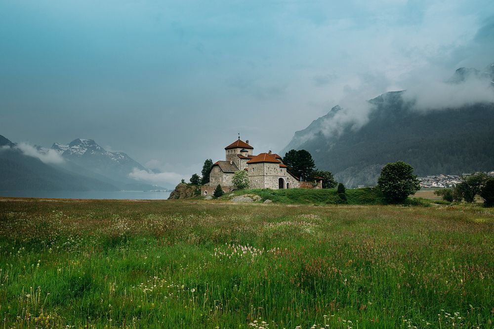 Historic castle in a grassy field in Saint Moritz. Original public domain image from Wikimedia Commons